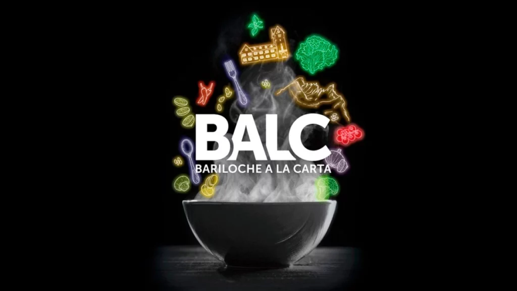 Logotipo do evento gastronômico Bariloche a la Carta (BALC) em uma tigela estilizada com ícones de alimentos flutuando ao redor.